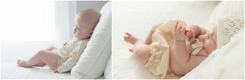 A baby plays with her chubby hands during a twin baby photography session. 