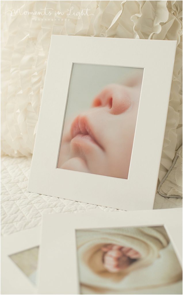 Houston fine art newborn photography is shown with a framed photograph. 