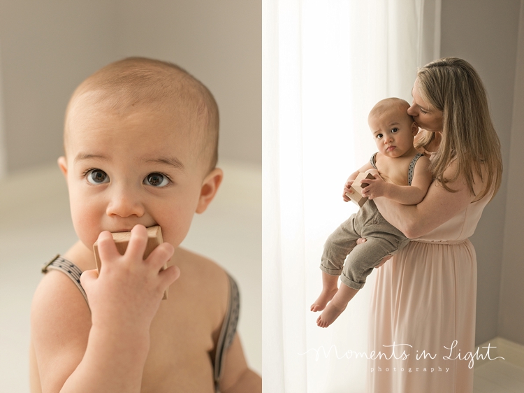 One year-old boy playing with blocks with mother by baby photographer in The Woodlands