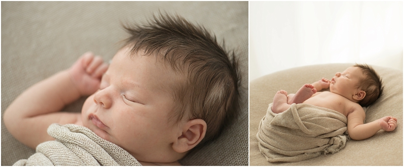 A baby sleeps while swaddled in a blanket. 