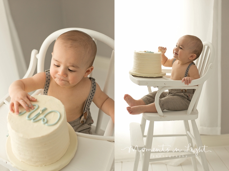 Baby boy eating first birthday cake in window of Montgomery, Texas photography studio