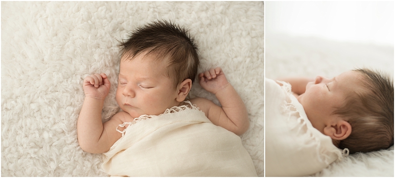 A baby sleeps on a furry blanket in the studio of Moments In Light Photography. 