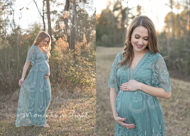 Pregnant woman smiling in field wearing green lace dress by maternity photographer in The Woodlands