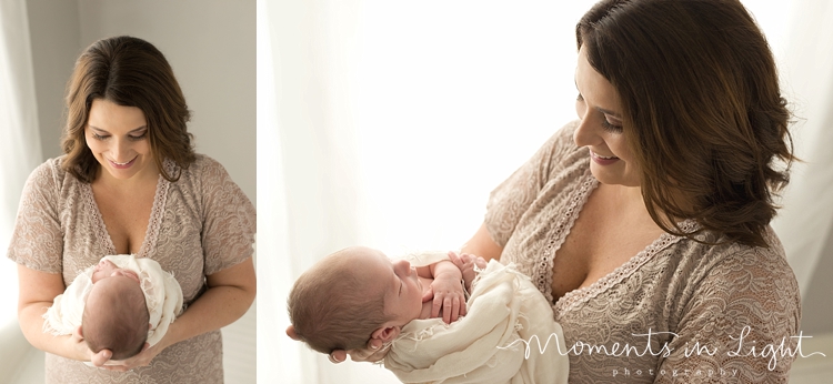 Mother holding newborn son in Montgomery, Texas photography studio