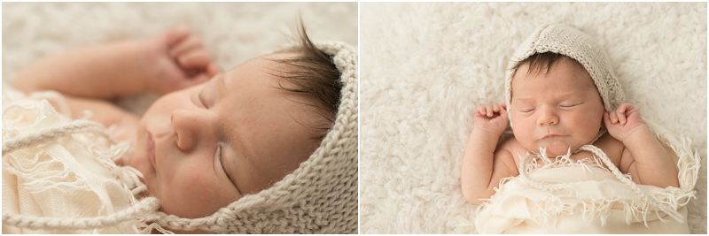 A newborn baby wears a knitted hat. 