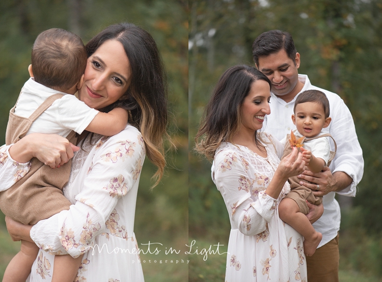 Mother and father in a field holding baby son by family photographer in Montgomery, Texas