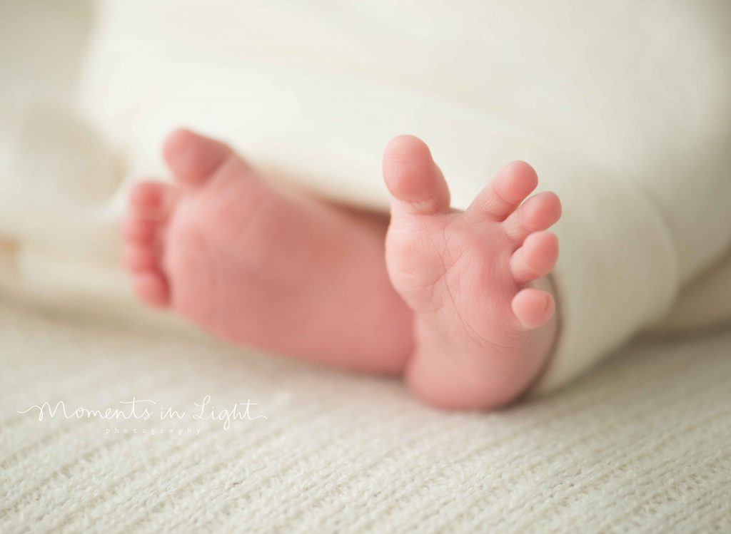 closeup of newborn baby feet in The Woodlands, TX