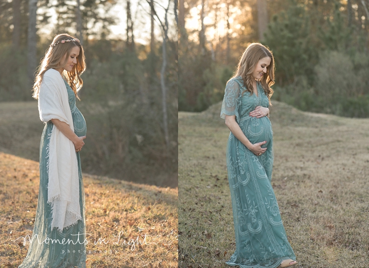 Woman in green lace dress holding pregnant belly in a field by Houston maternity photographer