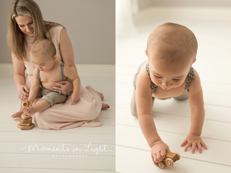 Mother playing on floor of Houston baby photography studio with her one year-old son