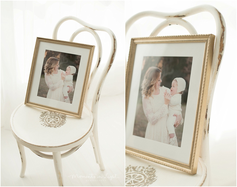 A framed portrait sits on a chair as an example of Houston fine art newborn photography. 