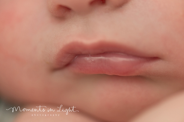 Closeup of baby boy's nose and lips by newborn photographer in The Woodlands