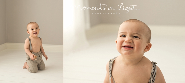 One year-old boy laughing in baby photography studio in The Woodlands