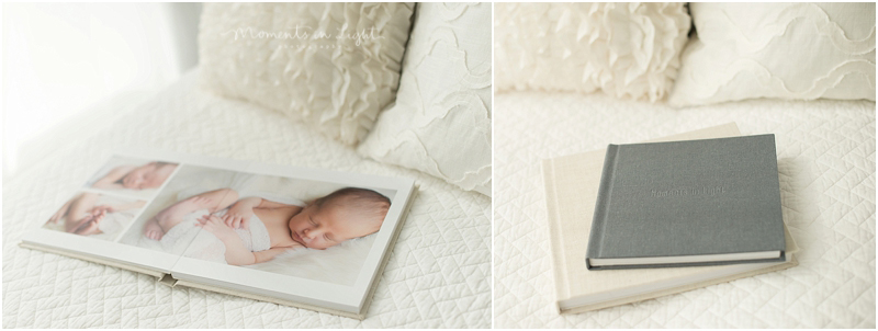 A photo album sits on a bed to show an example of Houston fine art newborn photography. 