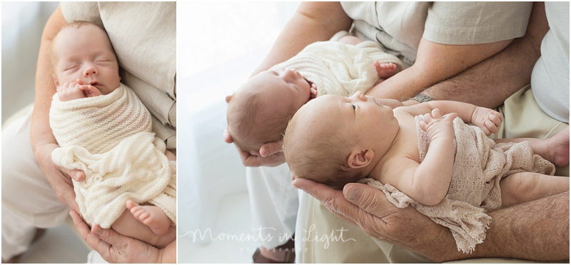 Twins are held by their grandparents during a session that featured newborn photography with family in The Woodlands, Texas. 