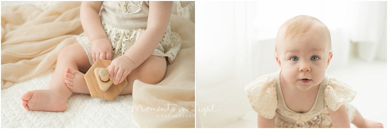 A blue eyed baby girl crawls towards the camera as a photo is snapped. 