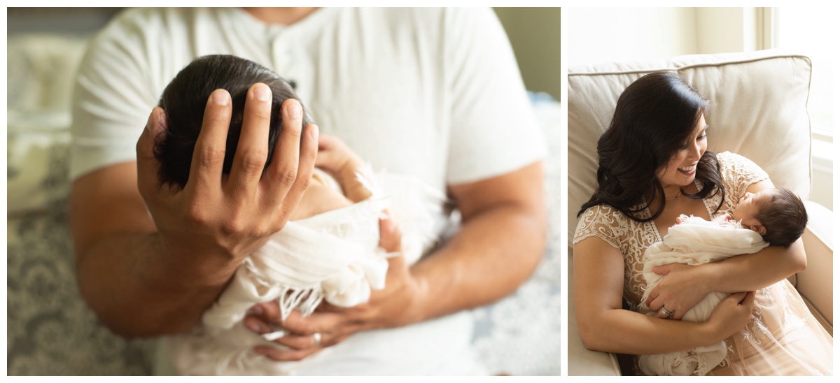 Father holding newborn's head in a photo studio in Montgomery, Texas