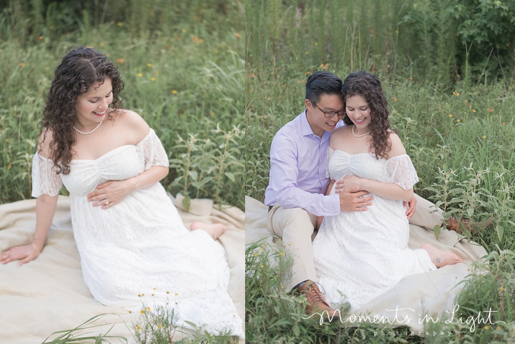 maternity photo in white lace dress lying in grass in Montgomery, Texas