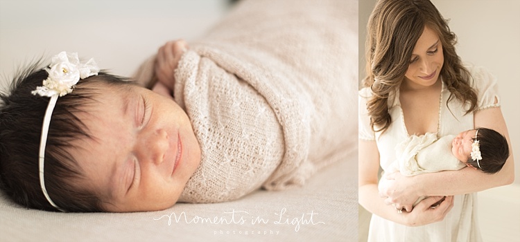 A newborn baby smiles in her sleep. 