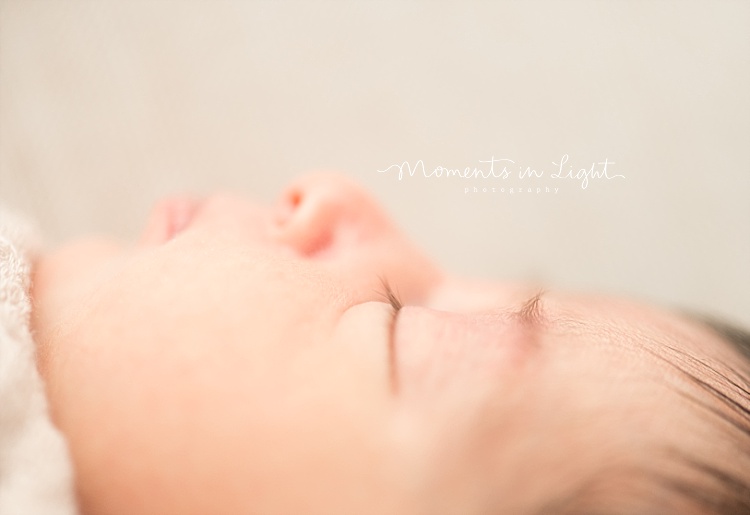 A baby girl newborn naps. 