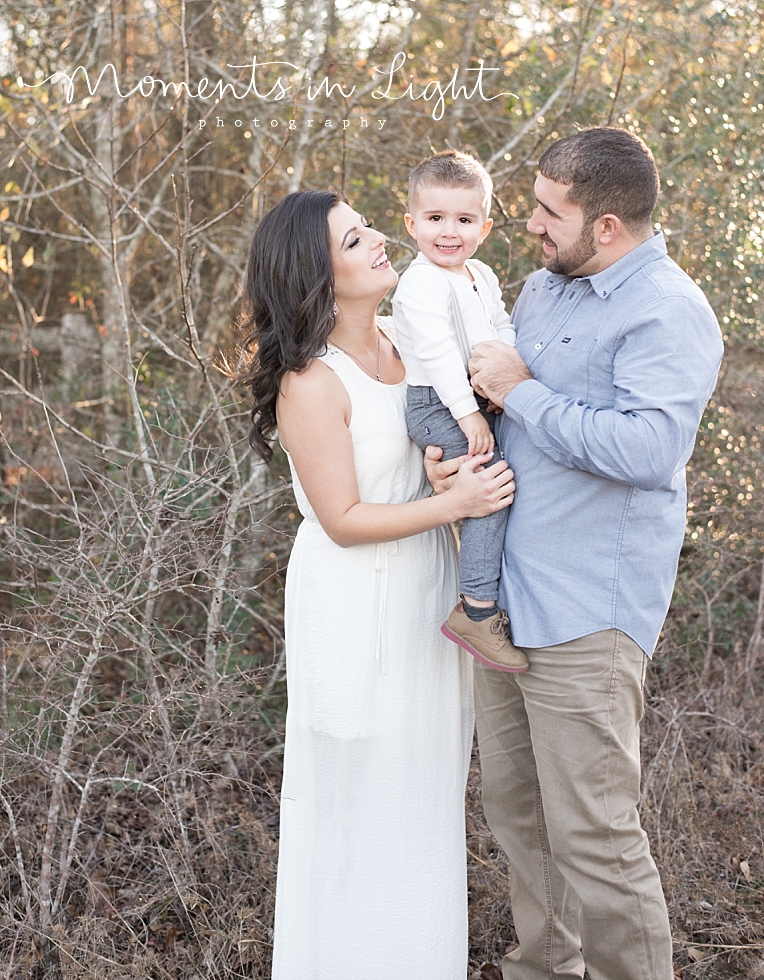 Parents hold their son | Natural Light Photography In Houston | Moments In Life Photography