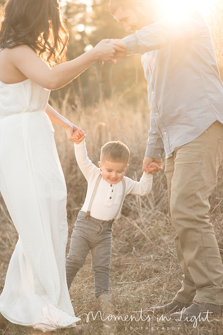 A family plays ring around the rosie | Natural Light Photography In Houston | Moments In Life Photography