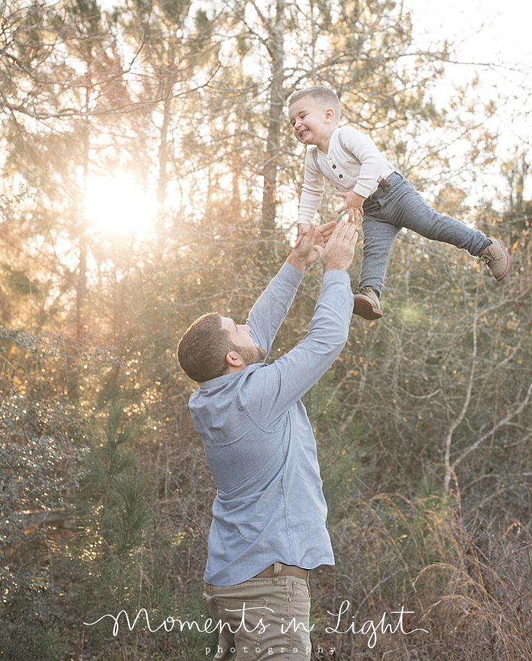 A boy throws his son up | Natural Light Photography In Houston | Moments In Life Photography