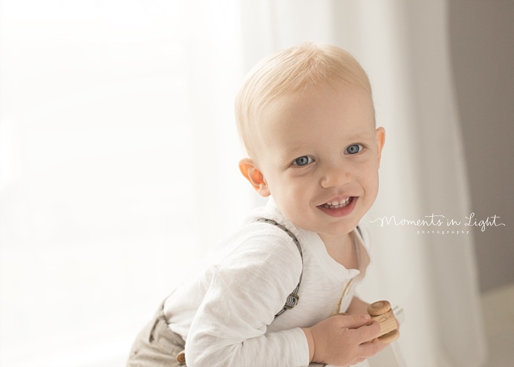 A toddler gives a smile. 