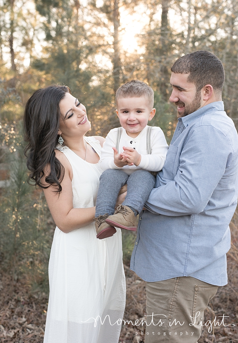 A boy smiles with his parents | Natural Light Photography In Houston | Moments In Life Photography