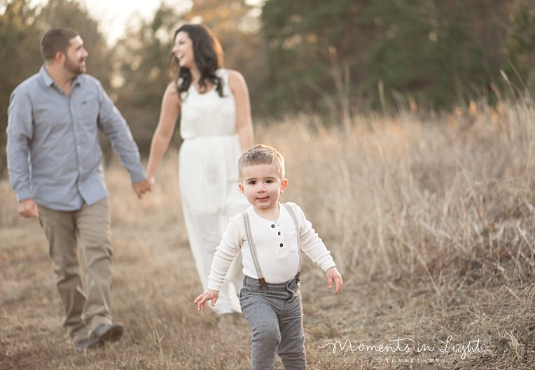 A boy runs from his parents | Natural Light Photography In Houston | Moments In Life Photography