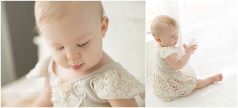 A baby girl sticks out her tongue as she concentrates. 