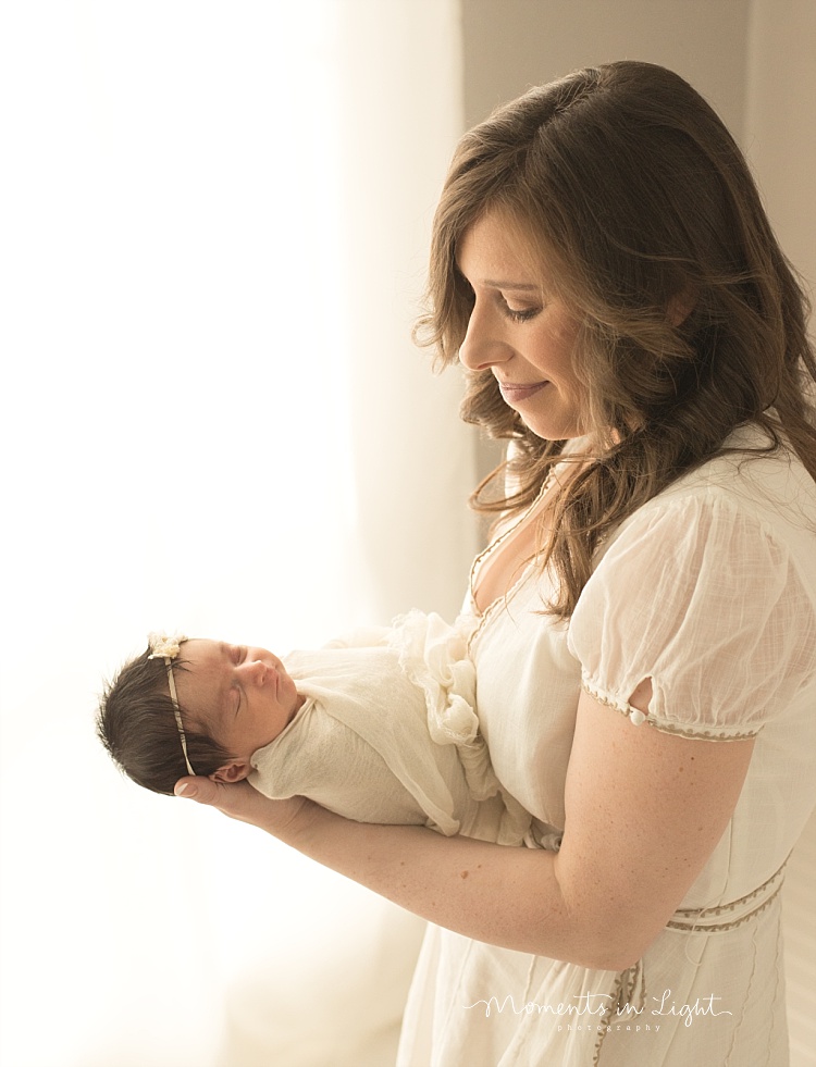 A mom holds her new baby. 