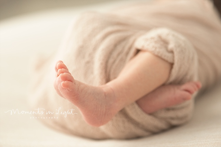 A baby's feet stretch. 