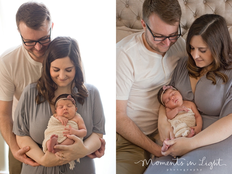 Mother and father holding baby daughter by newborn photographer in Montgomery, Texas 