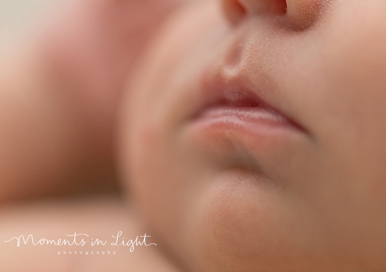 Closeup of baby's lips in a newborn photography studio in The Woodlands