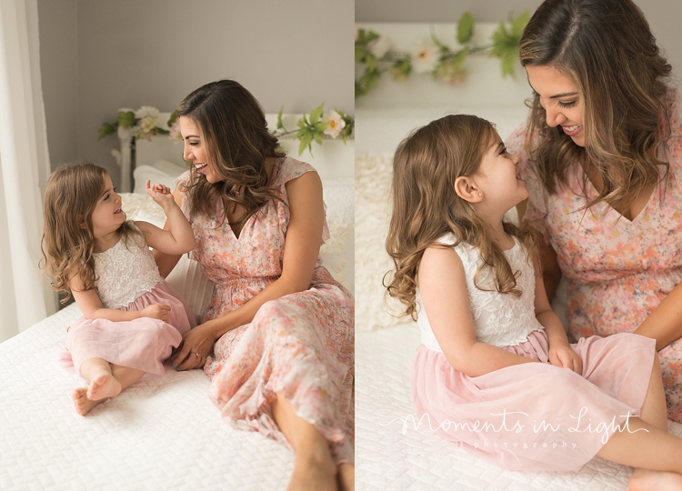 A mom and child sit and chat during a session with Moments In Light Photography. 