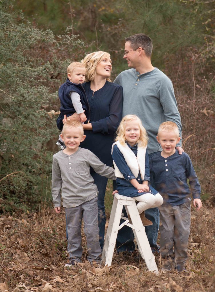 family photo with four children in a field in The Woodlands, TX | www.momentsinlightphotography.com